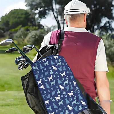 Person holding a golf bag with a dog pattern on a golf course